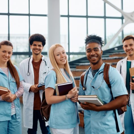 Multiracial,Group,Of,Happy,Students,Of,Medicine,In,Lecture,Hall